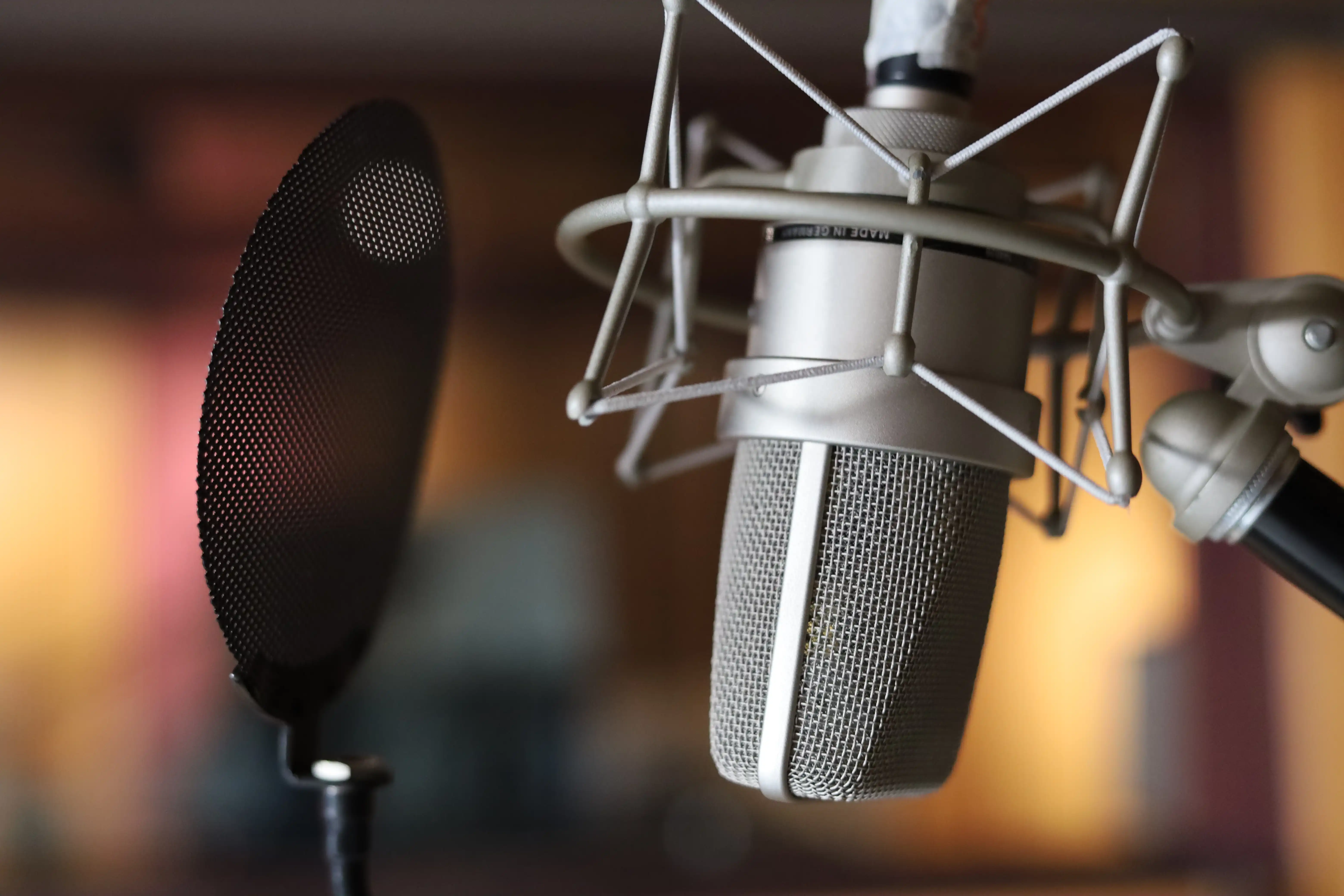 A professional music producer working in a recording studio environment.